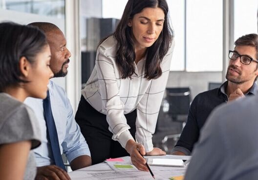 Business team discussing strategic decisions during a meeting in office
